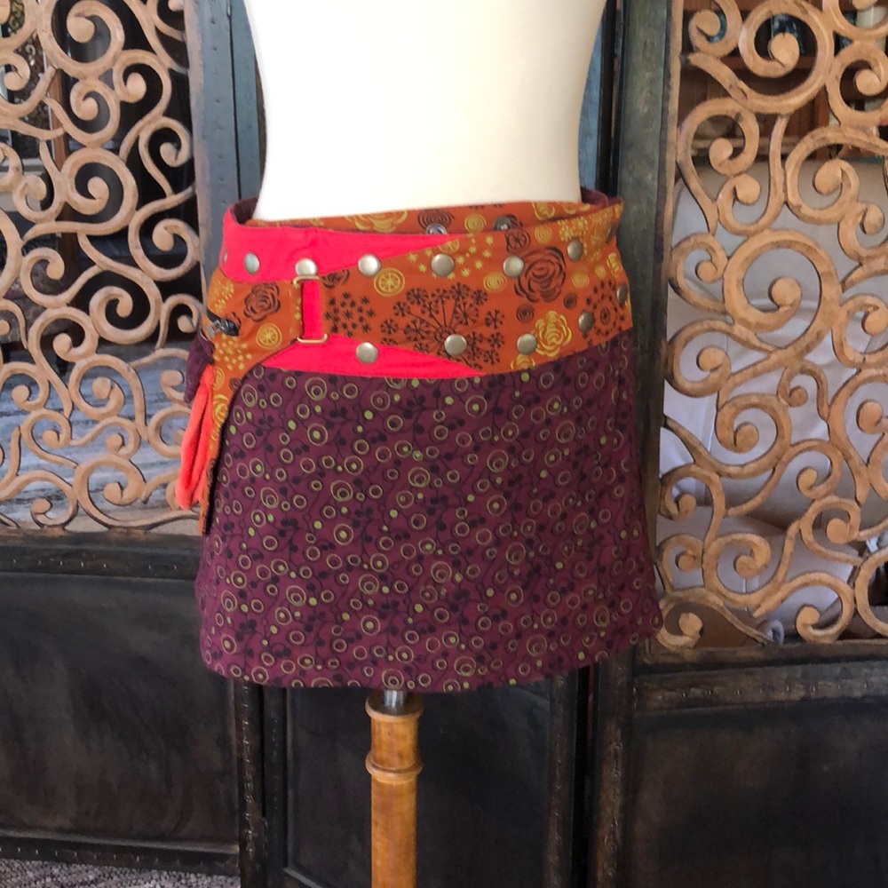 Mixed pattern reversible mini skirt.